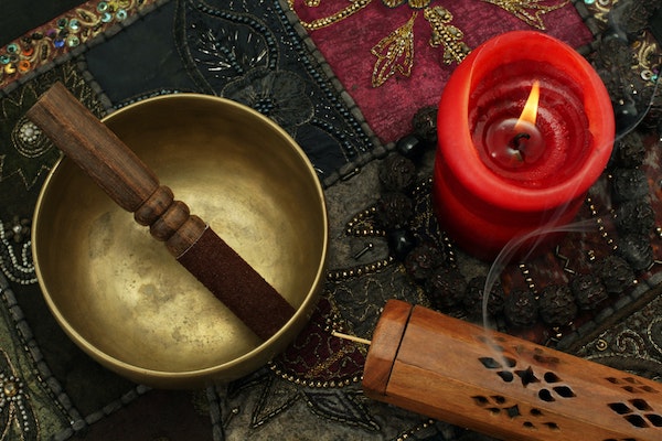 Meditation with sound bowl and candle