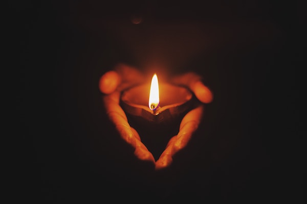 A person holding a candle